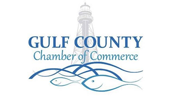 Logo for the Gulf County Chamber of Commerce featuring a lighthouse in the background and stylized blue waves with fish in the foreground.