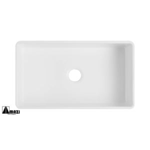 Rectangular white ceramic sink with a central drain hole, viewed from above. The sink has slightly rounded edges and a smooth surface.