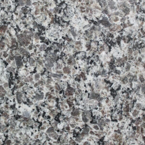 Close-up of a granite surface with a speckled pattern. The stone is predominantly gray with black, brown, and white mineral flecks, creating a natural, textured appearance.