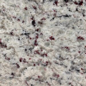 Close-up image of a granite surface featuring a mix of white, black, and red speckles. The texture is rough, with irregularly shaped patterns throughout the stone, creating a natural and varied appearance.