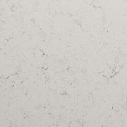 Close-up of a light beige textured surface with subtle gray and brown veining, resembling a natural stone pattern. The surface appears smooth with faint variations in tone and pattern, giving it an organic and sophisticated look.