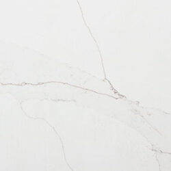 White marble surface with faint grey veining patterns running diagonally across.