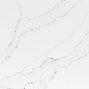 A close-up of white marble with delicate, thin, gold-veined patterns running diagonally across the surface. The texture appears smooth and elegant, emphasizing the natural beauty of the stone.