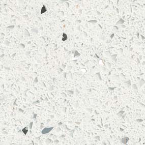 Close-up of a white terrazzo surface with small, irregular stone chips of various shades of gray and white embedded in a light gray background, creating a speckled pattern.