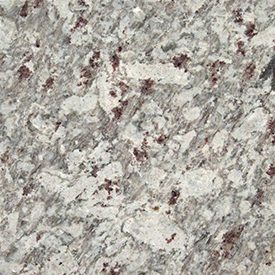 Granite surface with a speckled pattern of gray, white, and reddish-brown hues, creating a textured, natural stone appearance.