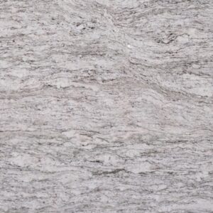 A detailed view of a slab of white granite featuring a natural pattern of swirling gray and faint beige streaks, showcasing its textured and speckled surface.