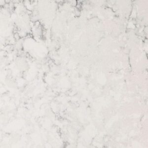 Close-up of a white marble surface with gray veins and subtle patterns. The texture is smooth and polished, showcasing natural stone details.