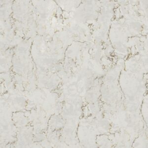 A close-up of a light-colored marble surface with subtle gray and gold veining patterns, creating a textured and elegant appearance. The veining is irregular and organic, adding depth and a natural aesthetic to the stone.