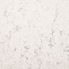 A textured white marble surface with light gray veining patterns throughout.