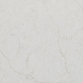 A close-up of a white marble surface with subtle gray veins running through it. The texture is smooth with a natural, polished appearance.