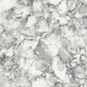 Close-up of a marble surface with a white and gray speckled pattern. The texture is smooth with a mix of light and dark tones, showing natural variations and veins typical of marble stone.