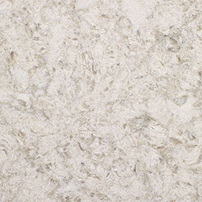 Close-up of a textured surface resembling light beige marble or stone, with irregular patterns and subtle variations in color and texture.