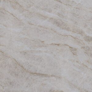 Close-up of a light gray marble surface with subtle brownish veins. The texture appears smooth and polished, displaying natural stone patterns and variations in color.