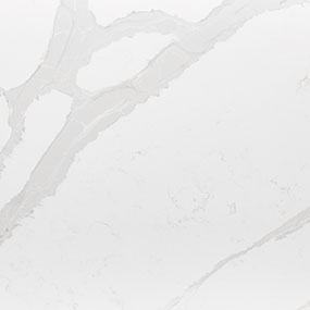 White marble surface with subtle gray veining patterns, creating an elegant and smooth appearance.