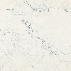 White marble surface with irregular gray veining patterns creating an elegant texture. The background appears smooth and polished, showcasing a natural and sophisticated look.