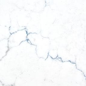 White marble surface with thin, dark blue veins running across it, creating an elegant and natural pattern. The texture is smooth and polished.