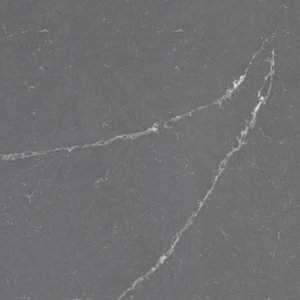 A smooth, dark gray stone surface with thin, white veining running diagonally and intersecting across the texture, resembling natural marble or granite.